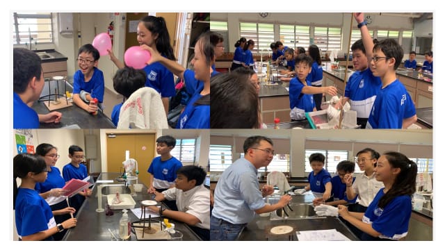Students in blue uniforms conduct science experiments in a lab, one holding a pink balloon.
